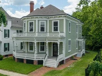 Older Fredericksburg, VA home with a wraparound porch and a vented crawl space foundation